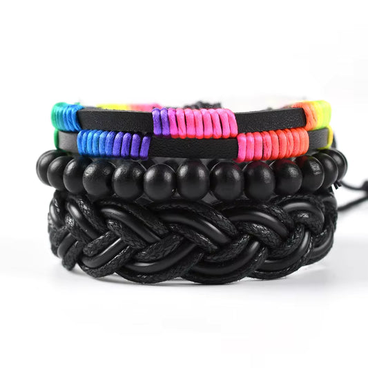Black rainbow pride bracelet set with braided leather, black beads, and colorful woven accents