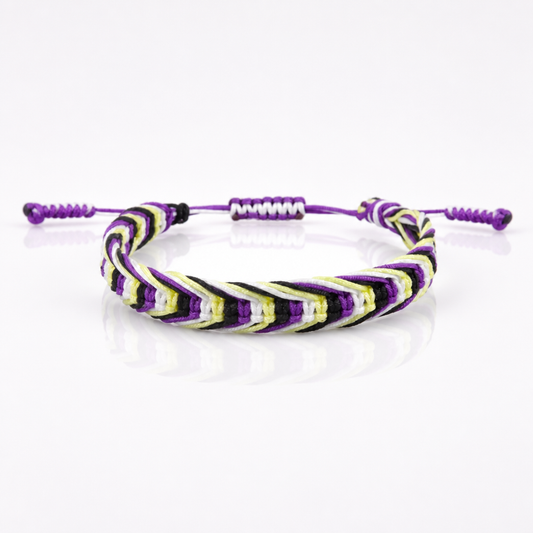 Nonbinary Pride woven cord bracelet with adjustable sliding knot closure in yellow white purple and black pride colors