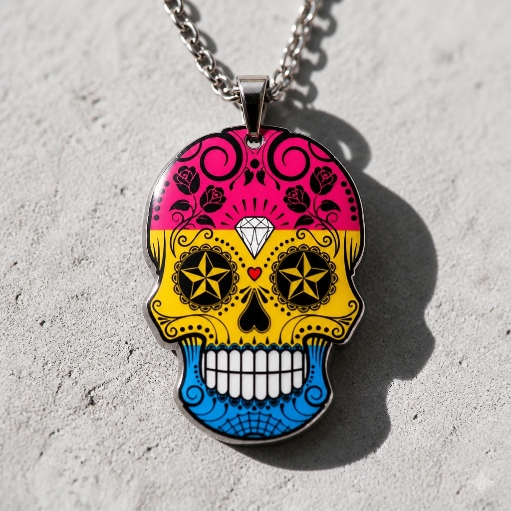 Pansexual pride sugar skull necklace with pink yellow and blue decorative skull pendant on stainless steel chain on a concrete background