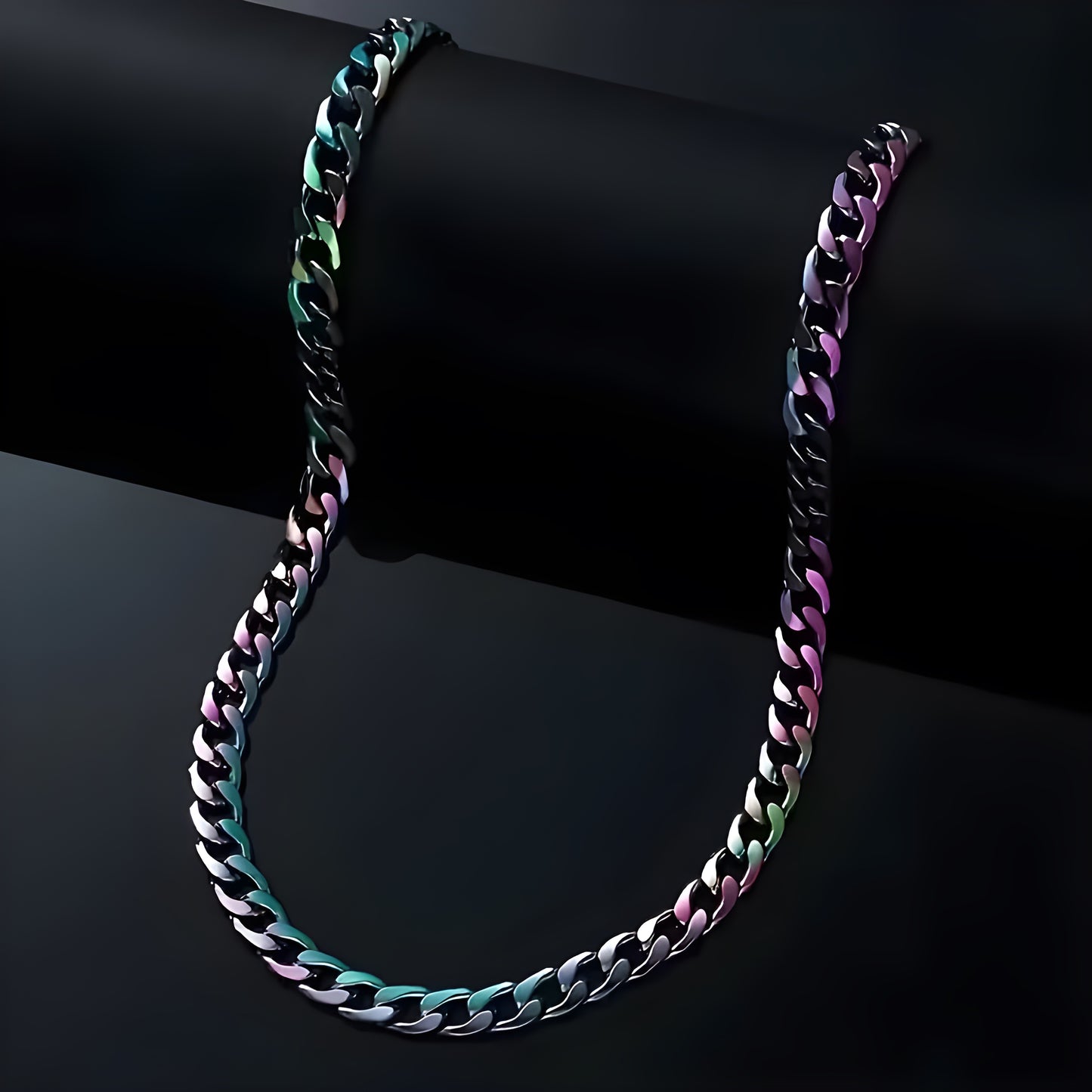 Chunky rainbow Cuban chain necklace with iridescent stainless steel oil-slick finish on a black background