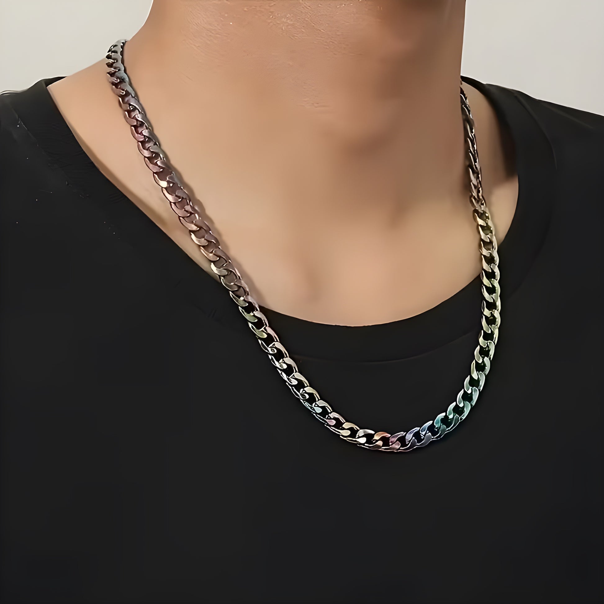 person wearing a Chunky rainbow Cuban chain necklace with iridescent stainless steel oil-slick finish