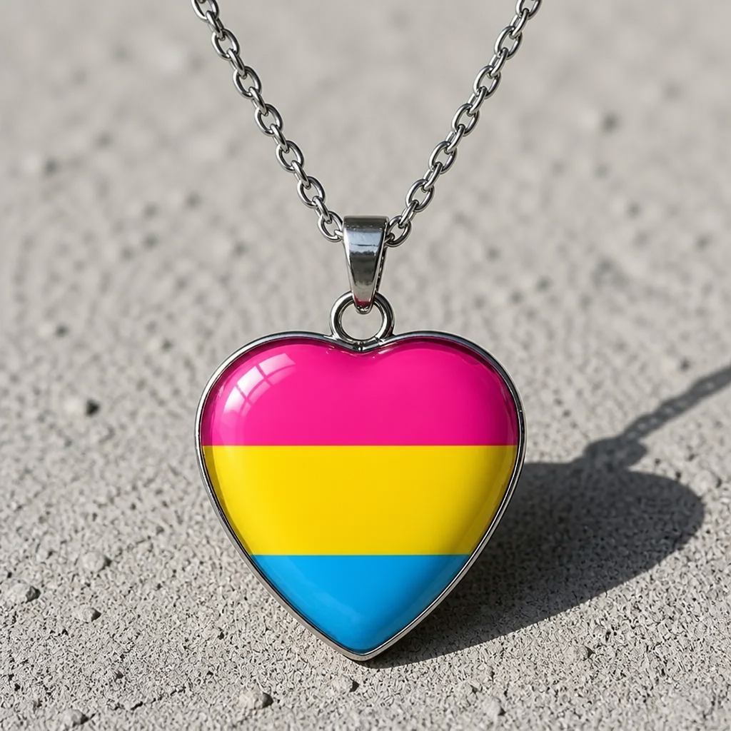 Pansexual Pride Heart Pendant Necklace with glossy heart pendant featuring the pansexual pride flag on a silver-tone chain on a concrete background