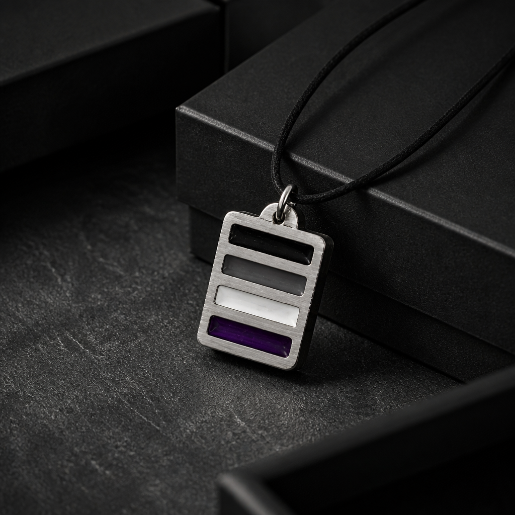 Handcrafted pewter pendant featuring the Asexual Pride flag in a modern geometric design on an adjustable black cord on a black jewelry box