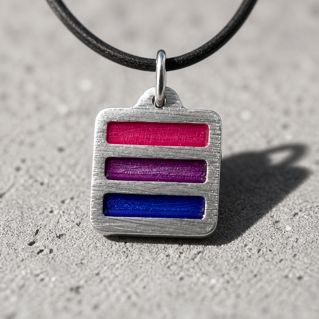 Handcrafted pewter pendant featuring the Bisexual Pride flag in a modern geometric design on an adjustable black waxed cord on a cement surface