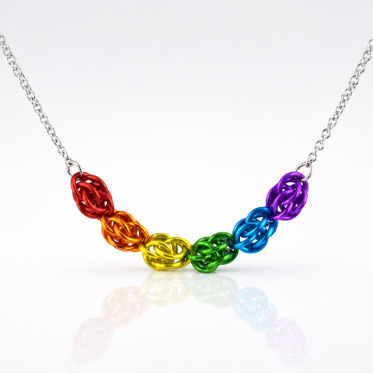 Hand-linked rainbow chainmail necklace featuring colorful aluminum rings on an adjustable stainless steel chain.