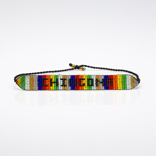 Handmade rainbow beaded Chingona bracelet with adjustable braided cord and colorful geometric woven design.