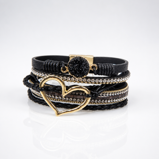 Black layered leather bracelet featuring an open gold heart, crystal accents, rhinestone details, and magnetic clasp.