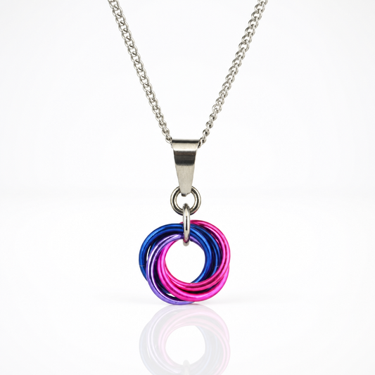 Handcrafted Bisexual Pride swirl pendant necklace featuring pink, purple, and blue aluminum rings on an adjustable stainless steel chain.