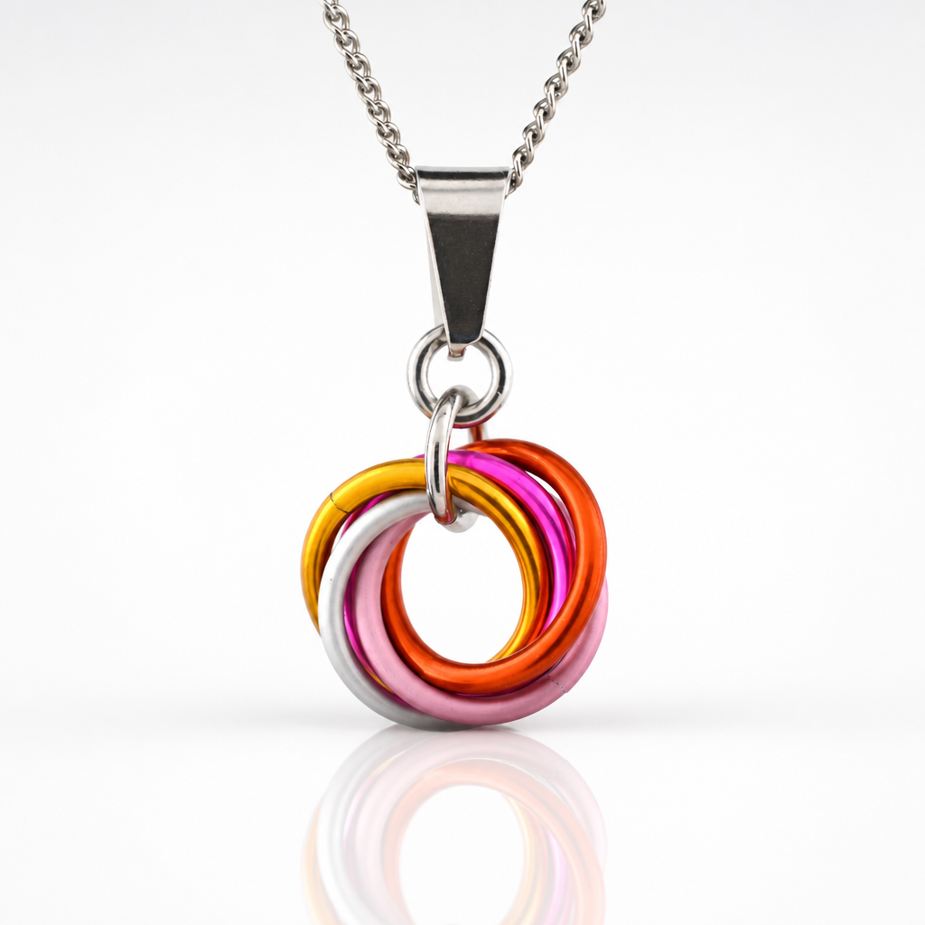 Handcrafted Lesbian Pride swirl pendant necklace featuring aluminum rings in Lesbian Pride flag colors on an adjustable stainless steel chain.