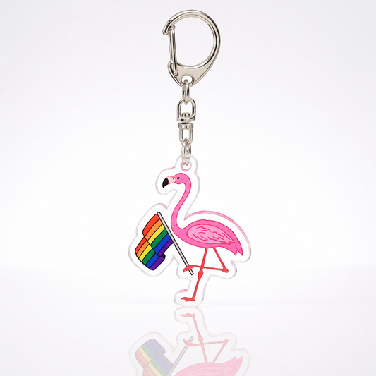 Pink flamingo acrylic keychain holding LGBTQ rainbow pride flag