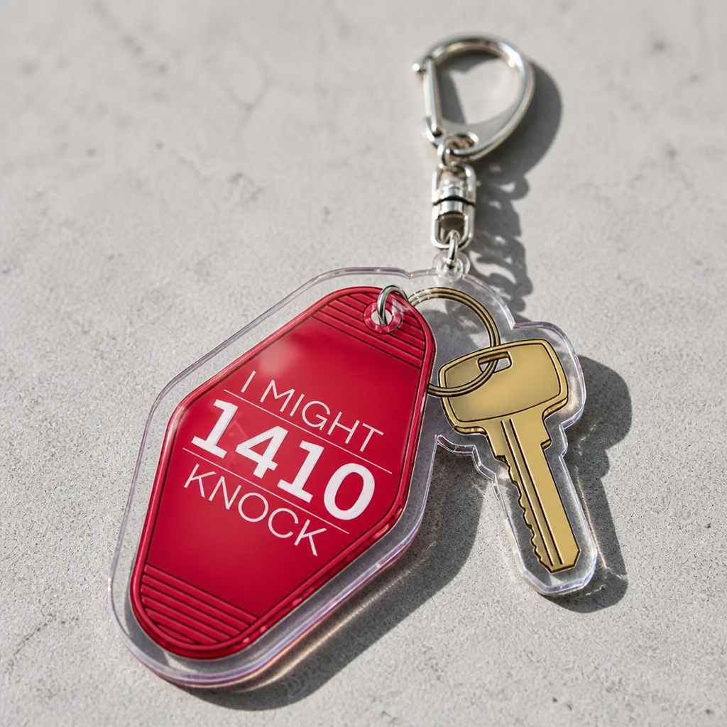 Heated Rivalry acrylic motel keychain with “1410 I Might Knock” quote and key charm on a concrete surface