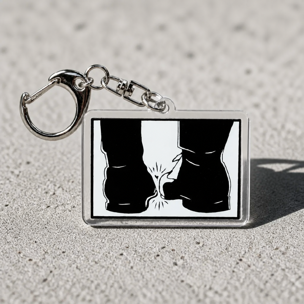 Heated Rivalry acrylic keychain featuring the iconic toe-touching press conference scene in black-and-white silhouette artwork on a concrete surface