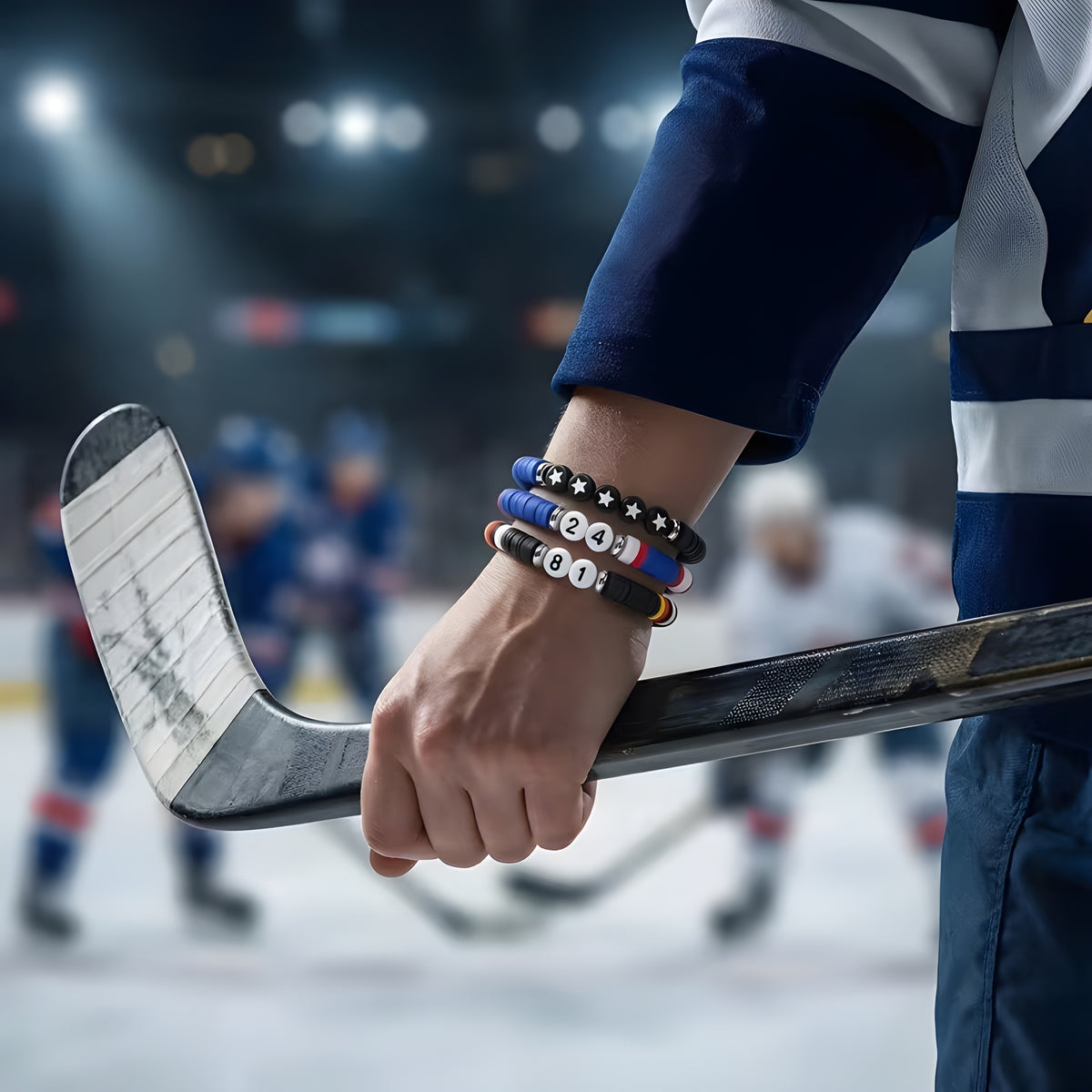 Three Heated Rivalry hockey bracelets with 81, 24 and star beads worn by a hockey player model