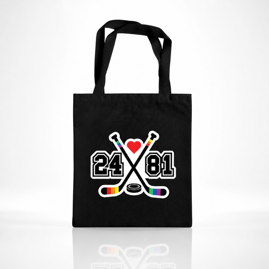 Black Heated Rivalry inspired tote bag with rainbow hockey stick 24/81 design and heart graphic
