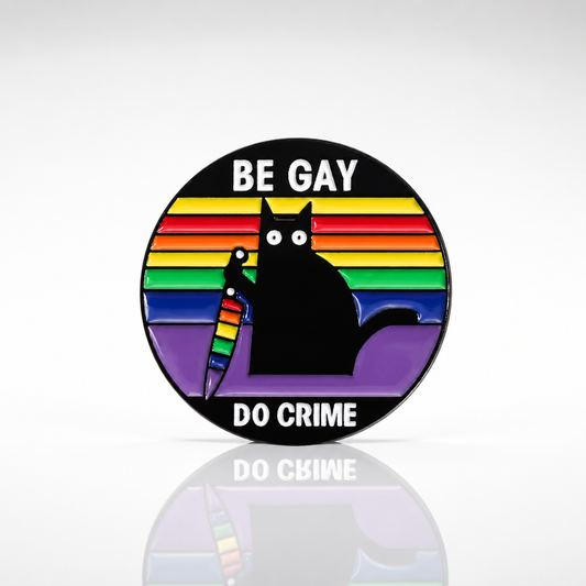 Be Gay Do Crime enamel pin featuring black cat holding rainbow knife with rainbow LGBTQ colors