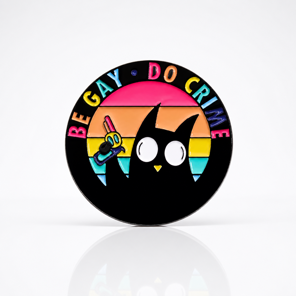 Be Gay Do Crime enamel pin featuring black cat holding rainbow gun with LGBTQ Pride colors