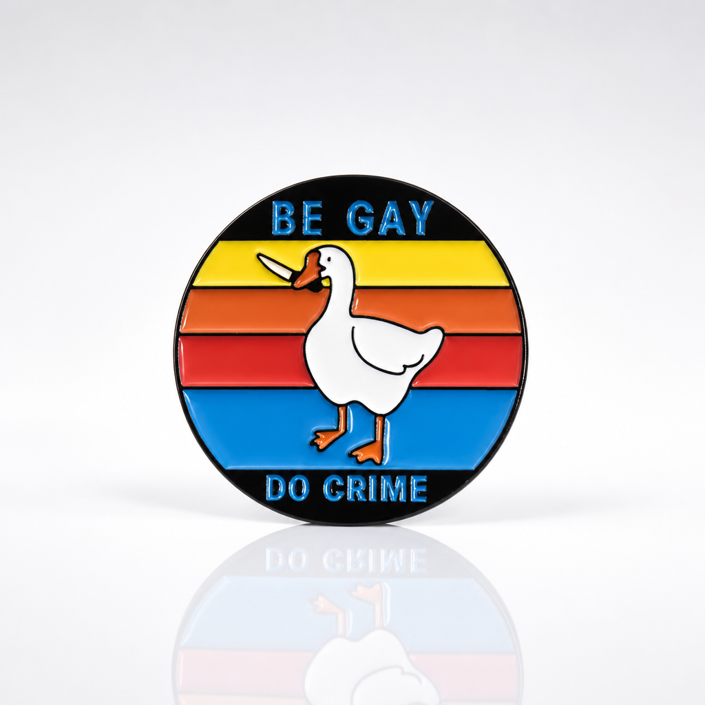 Be Gay Do Crime enamel pin featuring duck carrying knife with rainbow queer styling