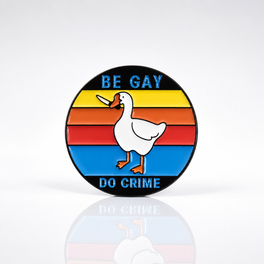 Be Gay Do Crime enamel pin featuring duck carrying knife with rainbow queer styling