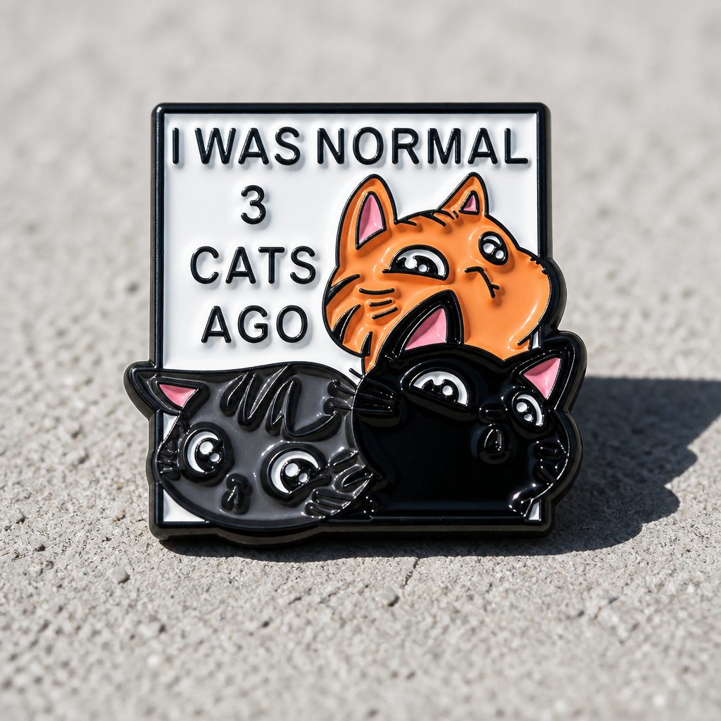 I Was Normal 3 Cats Ago enamel pin featuring three adorable cartoon cats on a concrete surface