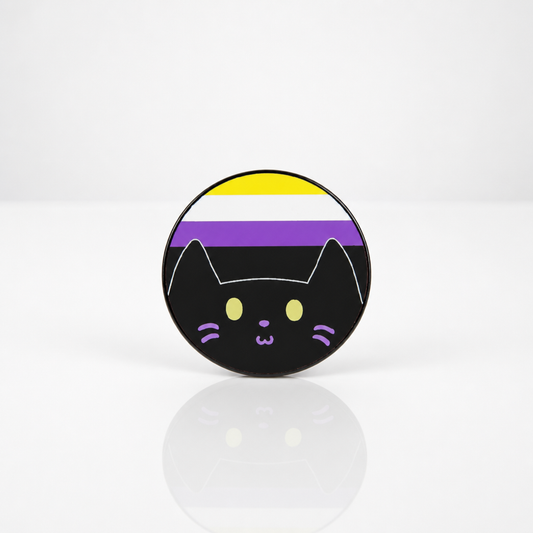 Hard enamel pin featuring a cute black kitty in front of the Nonbinary Pride flag in yellow, white, purple, and black.