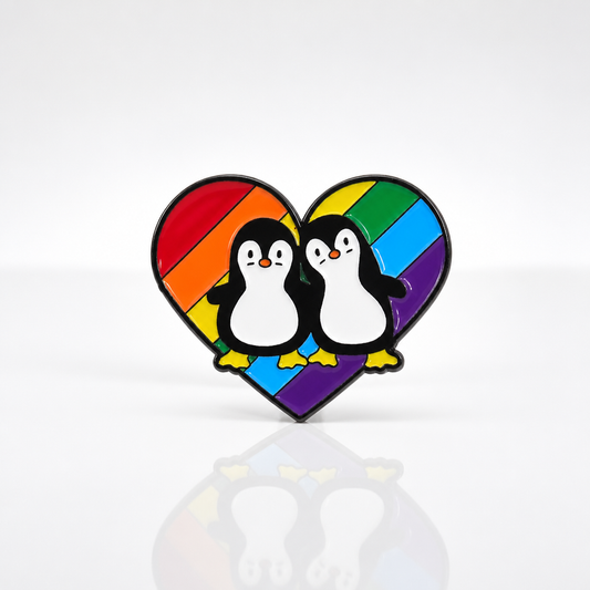 Cute penguin couple enamel pin standing on a rainbow pride heart background