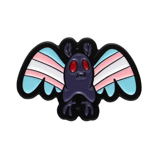 Mothman Trans Pride enamel pin featuring blue pink and white transgender Pride flag colors
