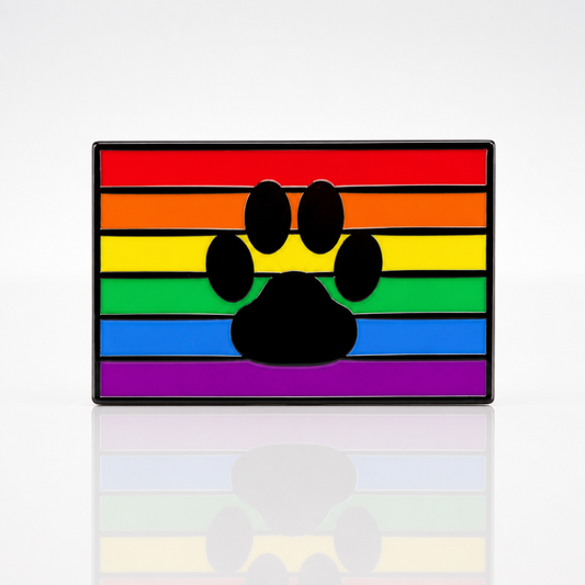 Rainbow Paw Pride enamel pin with black paw print over classic rainbow Pride flag colors 