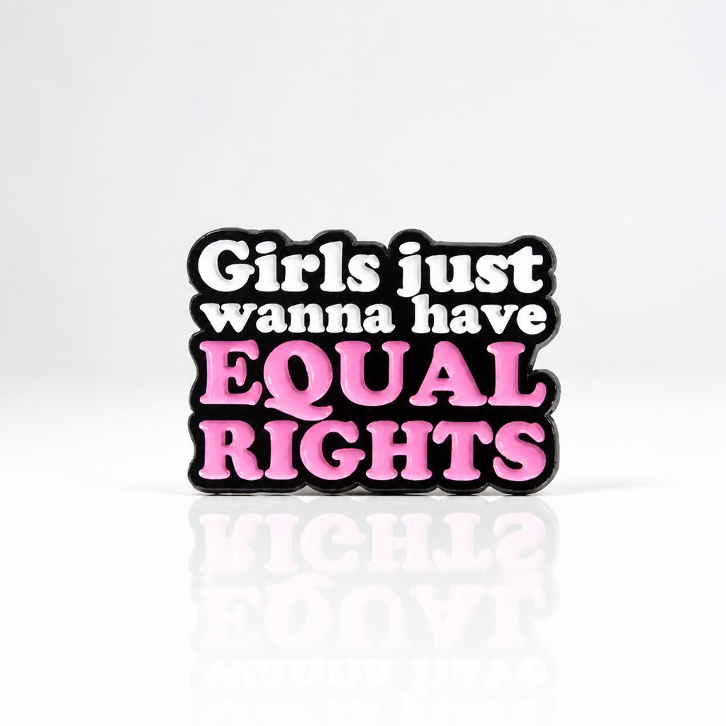 Pink and black enamel pin reading “Girls Just Wanna Have Equal Rights”