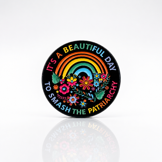 It’s A Beautiful Day To Smash The Patriarchy enamel pin with rainbow floral activist design