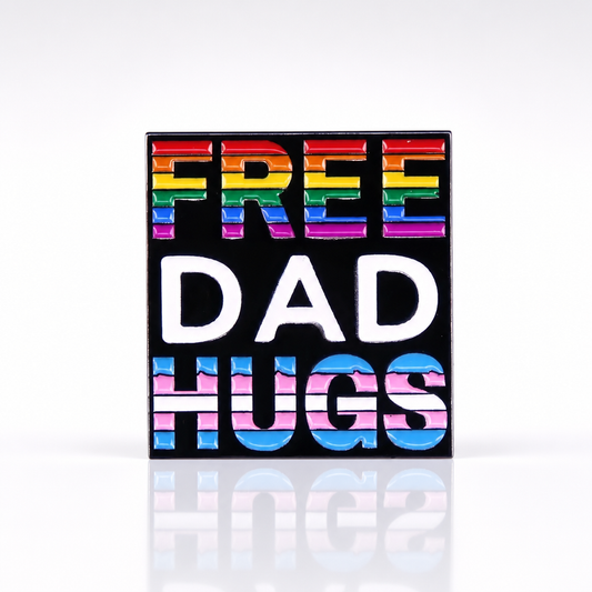 Free Dad Hugs enamel pin with Progress Pride rainbow colors on black background
