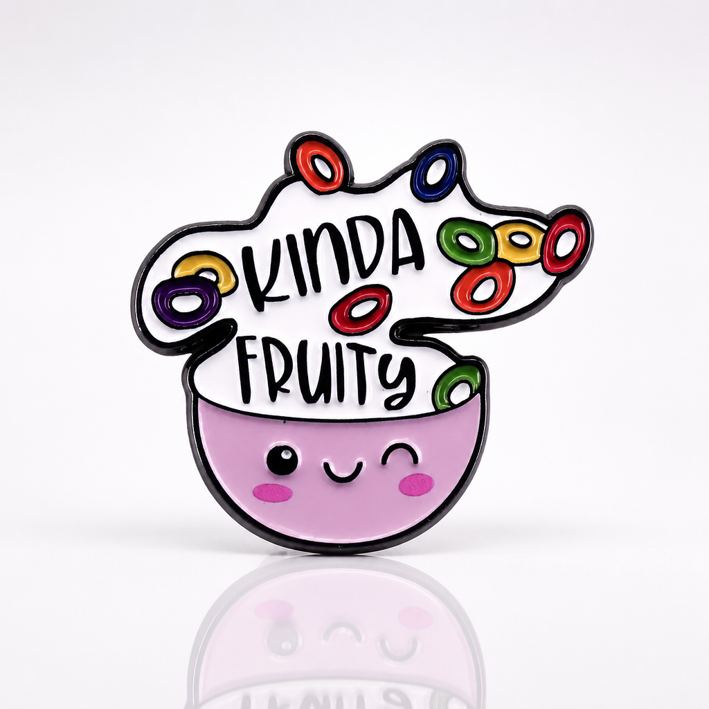 Cute enamel pin featuring smiling cereal bowl and the phrase “Kinda Fruity”