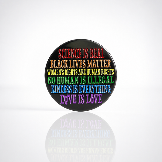 Science Is Real enamel pin with rainbow progressive human rights messaging