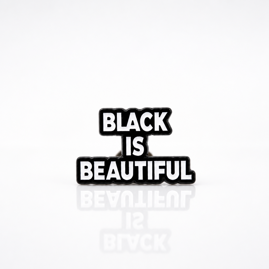 Black-and-white enamel pin reading “Black Is Beautiful” 