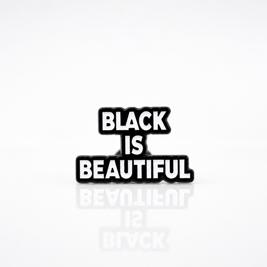 Black-and-white enamel pin reading “Black Is Beautiful” 