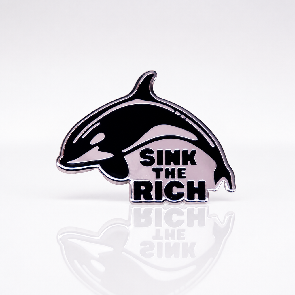 Black and white Sink The Rich orca enamel pin with killer whale design