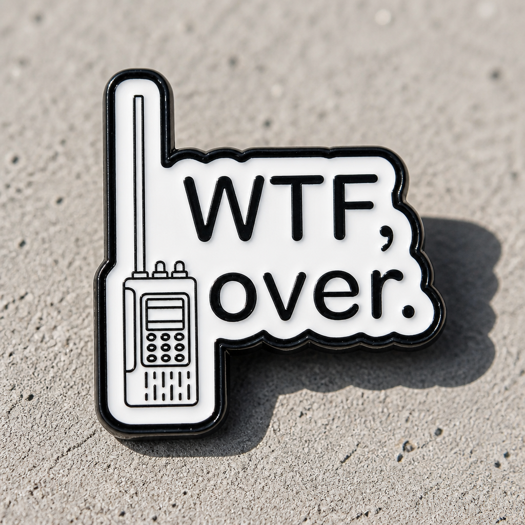 Funny WTF, Over enamel pin with retro walkie-talkie design and sarcastic humor text on a concrete surface