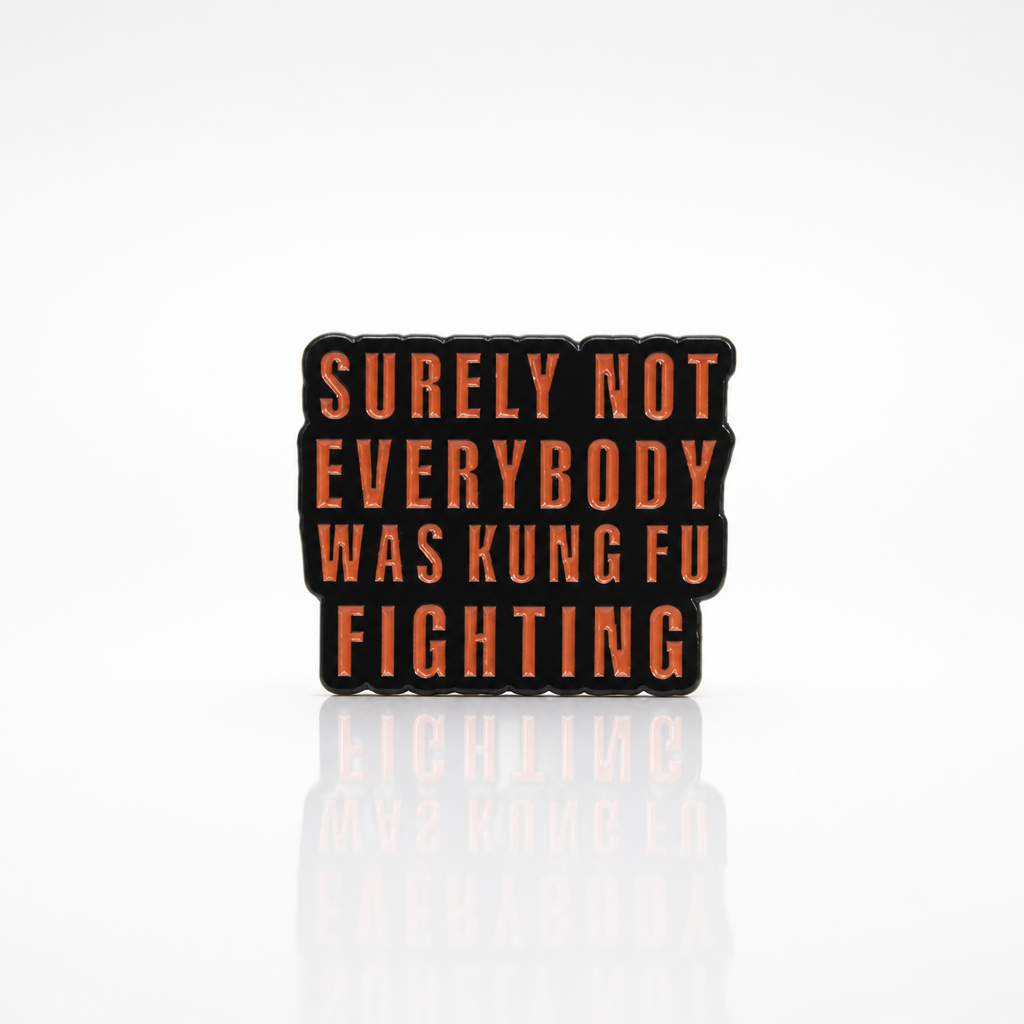 Surely Not Everyone Was Kung Fu Fighting enamel pin with bold red text design