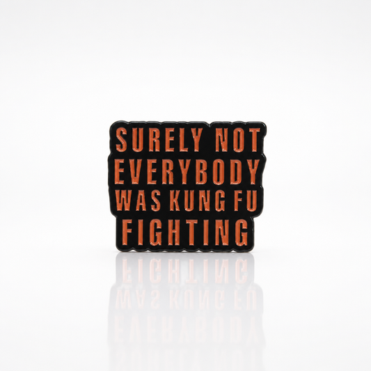 Surely Not Everyone Was Kung Fu Fighting enamel pin with bold red text design