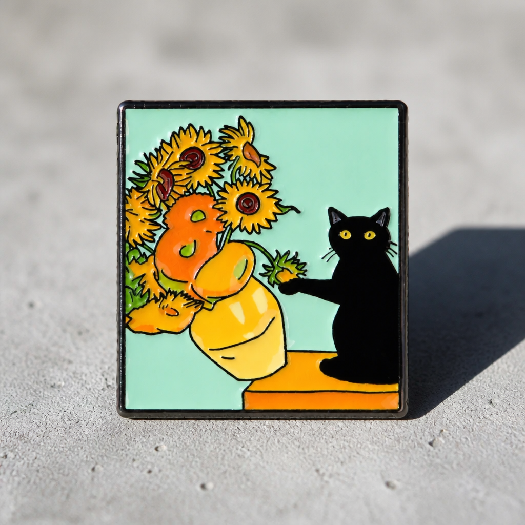 Funny enamel pin featuring a black cat pushing a vase of sunflowers off a table inspired by classic artwork on a concrete surface