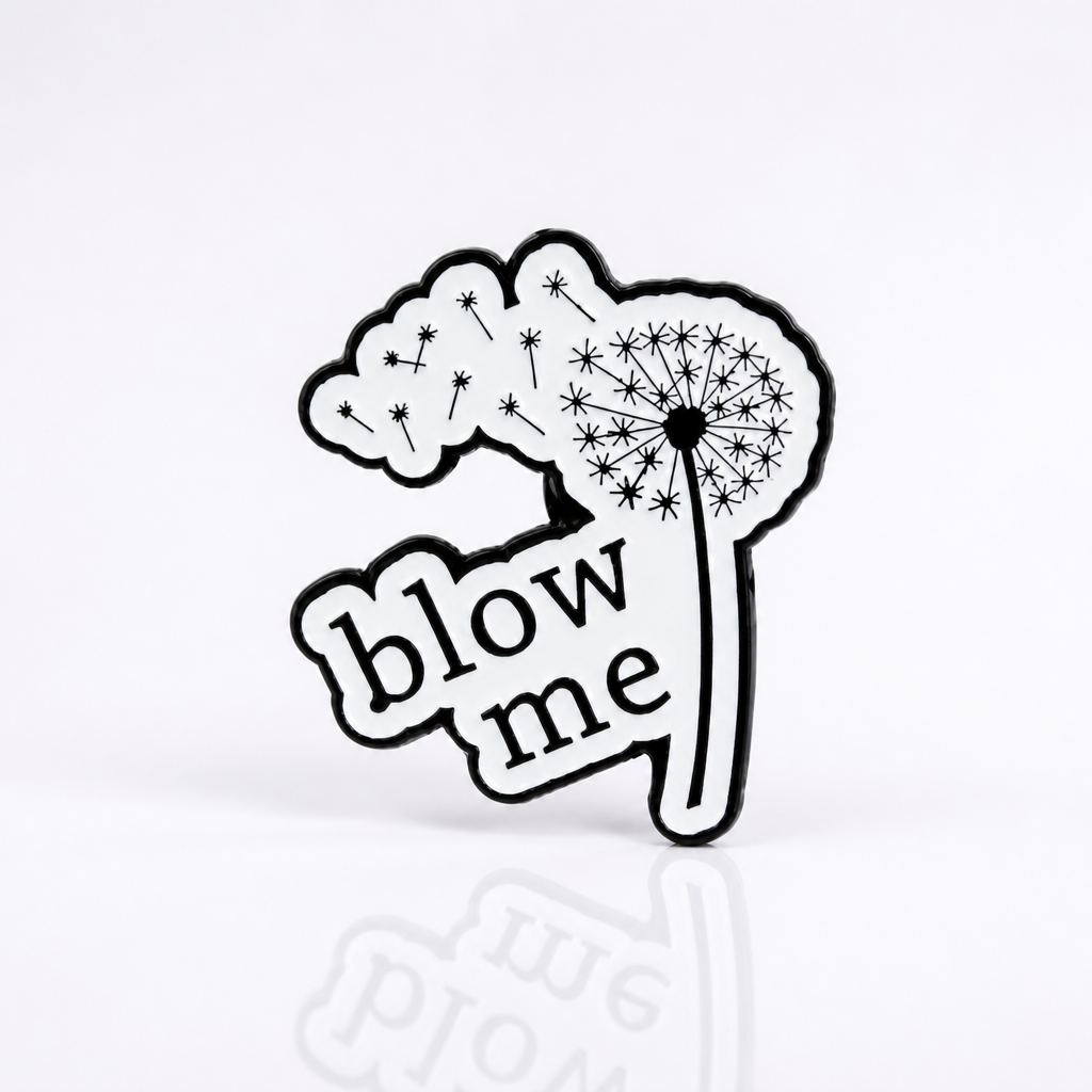 Black-and-white dandelion enamel pin with “Blow Me” text