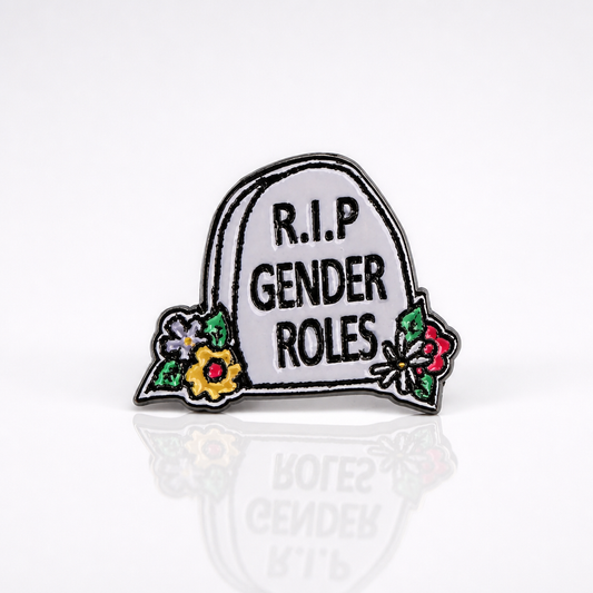 R.I.P. Gender Roles enamel pin featuring tombstone design with colorful flowers