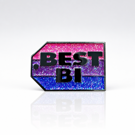 Glitter bisexual Pride enamel pin reading “Best Bi” in bold lettering 