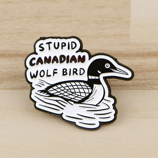 Heated Rivalry enamel pin featuring loon bird artwork and “Stupid Canadian Wolf Bird” quote