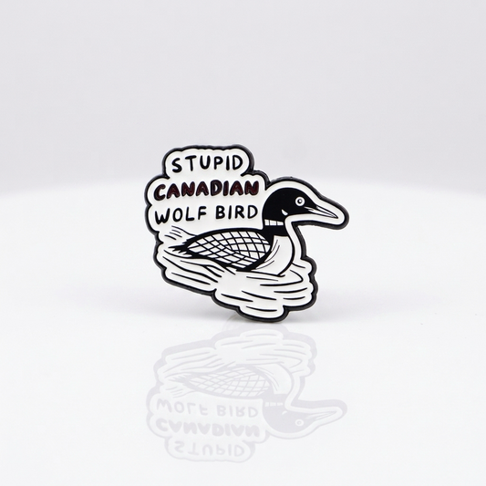 Heated Rivalry enamel pin featuring loon bird artwork and “Stupid Canadian Wolf Bird” quote