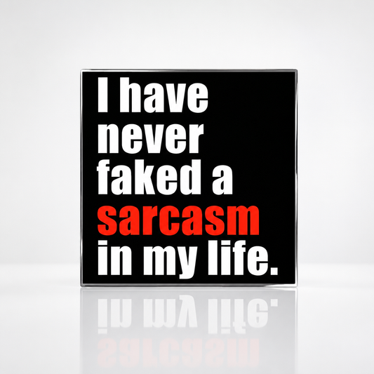 Black enamel pin featuring the phrase "I Have Never Faked a Sarcasm in My Life" with the word "sarcasm" highlighted in red.