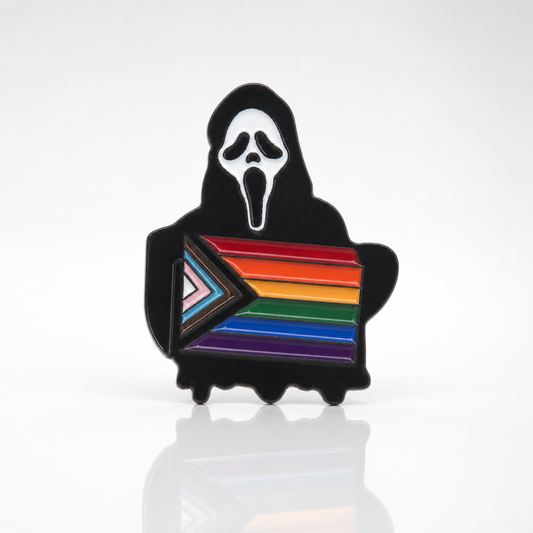 Ghostface-inspired enamel pin featuring a black robed horror character holding the Progress Pride flag