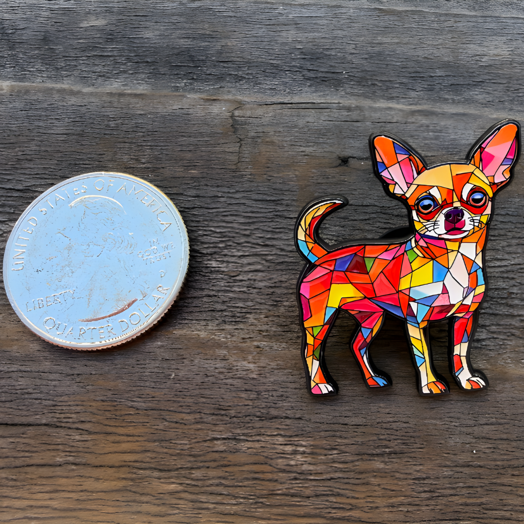 Colorful stained glass Chihuahua enamel pin with geometric mosaic artwork next to a quarter for size reference