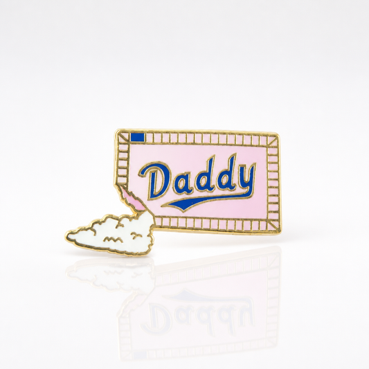 Sugar Daddy enamel pin featuring pastel candy-inspired artwork with gold-tone details