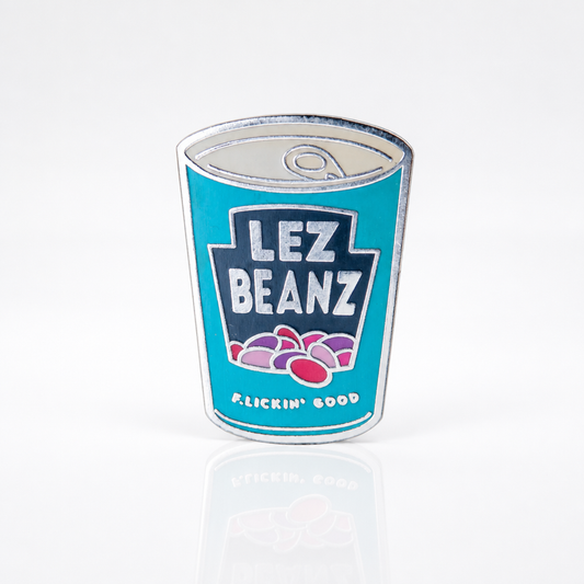 Lez Beanz enamel pin featuring a retro-style can of beans with playful lesbian pride humor