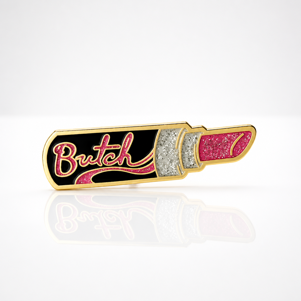 Butch Lipstick enamel pin featuring glitter pink lipstick artwork with gold-tone details